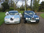 Silvery Blue and British Racing Green Jaguar S-Types at a wedding in November 2009