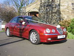 Metallic Red Jaguar S-Type at a wedding in November 2011