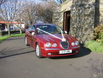 Metallic Red Jaguar S-Type at a wedding in November 2011