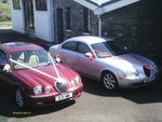 Jaguar S-Types in Metallic Red and Metallic Silver at a wedding on 28 April 2012