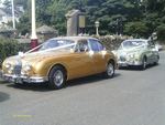 1967 Jaguar Mark 2 in Metallic Gold and 1967 Daimler 2.5 V8 in Willow Green at a wedding on 14 July 2012