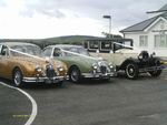 1967 Jaguar Mark 2 in Metallic Gold, 1967 Daimler 2.5 V8 in Willow Green and 1929 Essex Super Six Challenger at a wedding on 14 July 2012