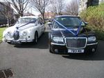 Jaguar Mark 2 in Old English White and Chrysler 300 Saloon in Black